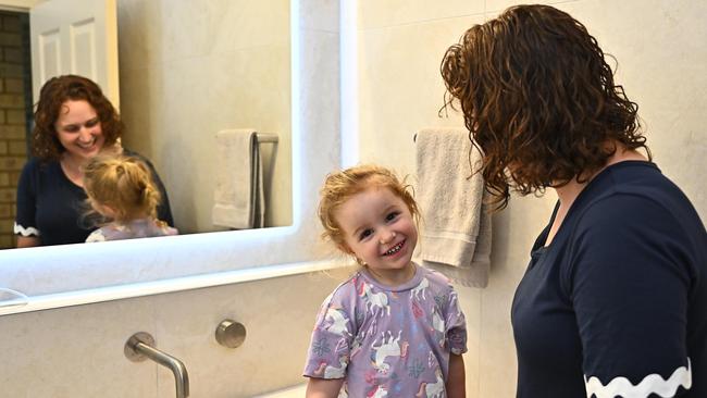 Three-year-old Astrid Thorpe practices her tooth brushing technique with mum Laura Thorpe. Picture Emily Barker.