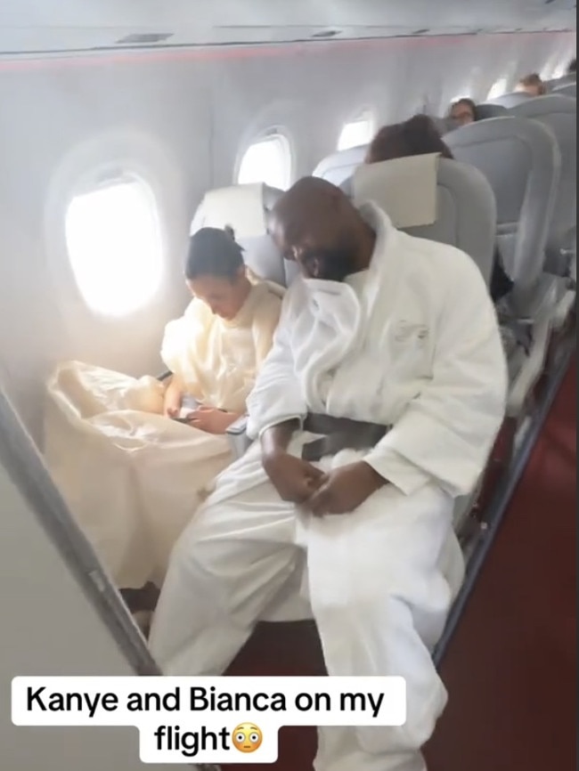 Kanye West and Bianca Censori were filmed on-board a flight in economy. Picture: TikTok/@brandon.doggett