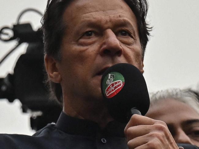 Pakistan's former prime minister Imran Khan (C) addresses his supporters during an anti-government march towards capital Islamabad, demanding early elections, in Gujranwala on November 1, 2022. (Photo by Arif ALI / AFP)