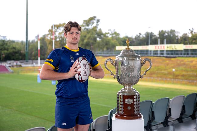 Utility forward Charlie Macauley poses with the StoreLocal Hospital Cup trophy ahead of last year's finals series.