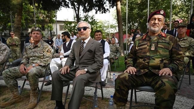 General Austin Miller (L), US top commander of coalition forces in Afghanistan with Chairman of Afghanistan's High Council for National Reconciliation, Abdullah Abdullah (C) and Defence Minister General Bismillah Khan Mohammadi (R) during an official handover ceremony at the Resolute Support headquarters in the Green Zone in Kabul last month. Picture: AFP.