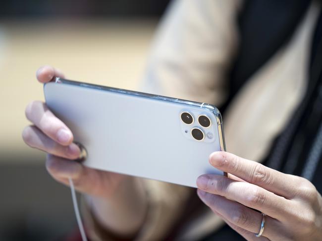 TOKYO, JAPAN - SEPTEMBER 20: A customer tries an iPhone 11 Pro Max in the Apple Marunouchi store on September 20, 2019 in Tokyo, Japan. Apple Inc. launched the latest iPhone 11 models featuring a dual-camera system today.  (Photo by Tomohiro Ohsumi/Getty Images)