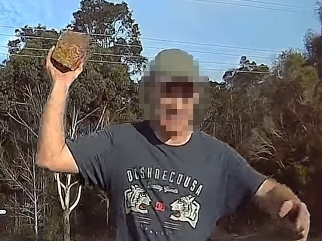 Shocking dash camera footage has emerged of a ranting man approaching a car armed with a brick and smashing a window on the NSW Central Coast. The incident on James Watt Dr in Chittaway Bay has resulted in a man being charged by police. Picture: DashCam Australia