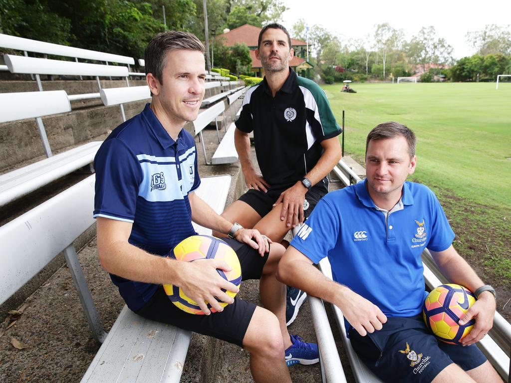 New Brisbane Roar coach Warren Moon (right) with fellow club foundation players Matt McKay (left) and Remo Buess. Picture: AAP Image/Claudia Baxter