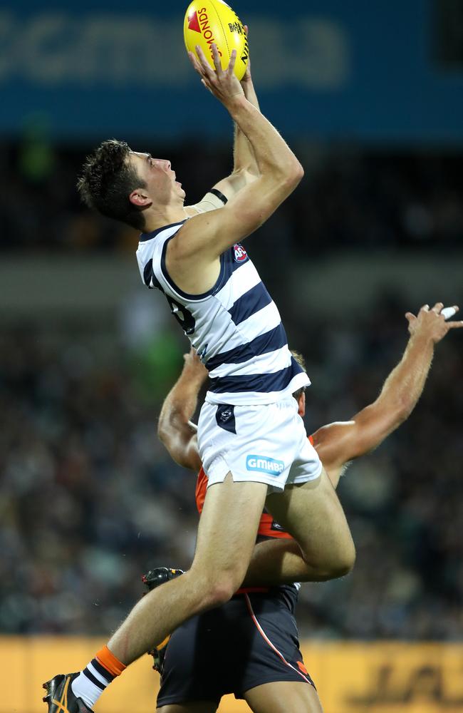 Cats coach Chris Scott encourages Jack Henry to fly for marks.