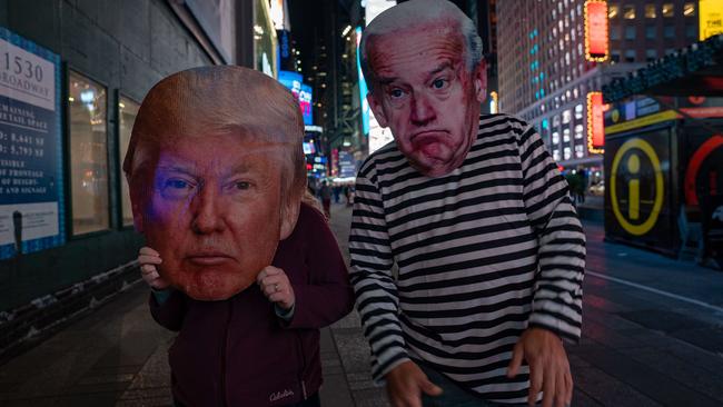 People in Times Square dress as Donald Trump and Joe Biden costumes as they await election results in New York. Picture: AFP