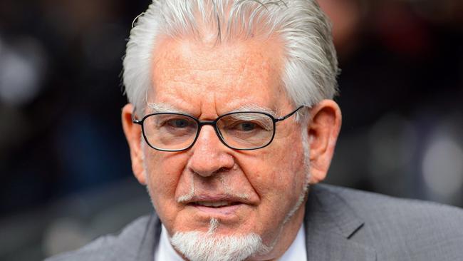 Veteran entertainer Rolf Harris, arrives at Southwark Crown Court to be sentenced, in London, Friday, July 4, 2014. Australian-born Harris, 84, was found guilty of 12 counts of indecent assault on four victims aged 19 or under between 1968 and 1986. Harris was sentenced to five years and nine months in prison. (AP Photo/PA, Dominic Lipinski) UNITED KINGDOM OUT NO SALES NO ARCHIVE