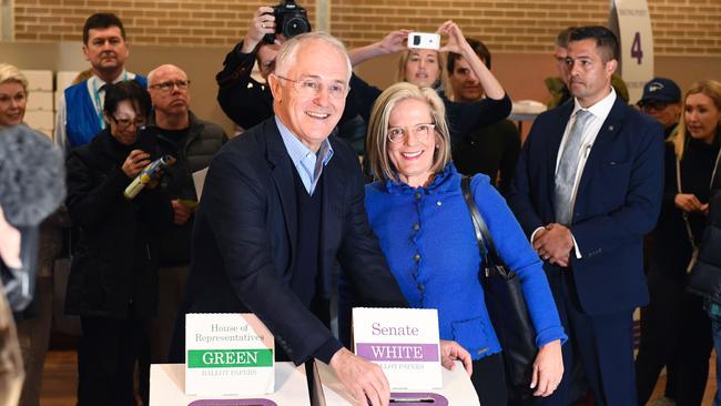 Australia's Prime Minister Malcolm Turnbull (L) and his wife Lucy (R) cast their vote in Sydney.