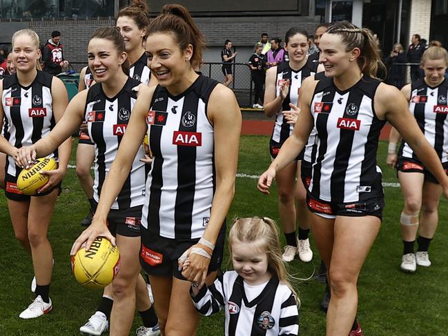 MELBOURNE, AUSTRALIA - SEPTEMBER 23: Collingwood players run out before the round five AFLW match between the Collingwood Magpies and the Essendon Bombers at AIA Centre on September 23, 2022 in Melbourne, Australia. (Photo by Darrian Traynor/Getty Images)