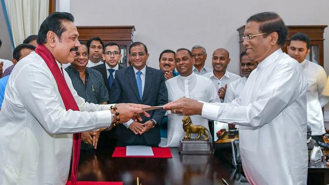 Mahinda Rajapakse after being sworn in as prime minister by President Maithripala Sirisena in Colombo on Friday. Picture: AFP