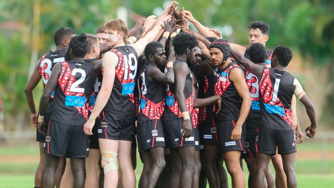 Cyril Rioli, right front, celebrates with his Tiwi teammates on Bathurst Island. Picture GLENN CAMPBELL