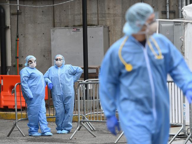 Medical staff stand outside a COVID-19 screening tent at the Brooklyn Hospital Centre. Picture: AFP