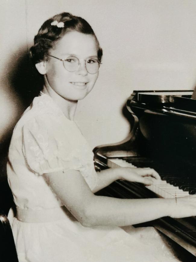 Glyn Scott aged around 12 playing the piano at her adoptive parents Jeannie and Charles Harden's Alberton home. Picture: Supplied