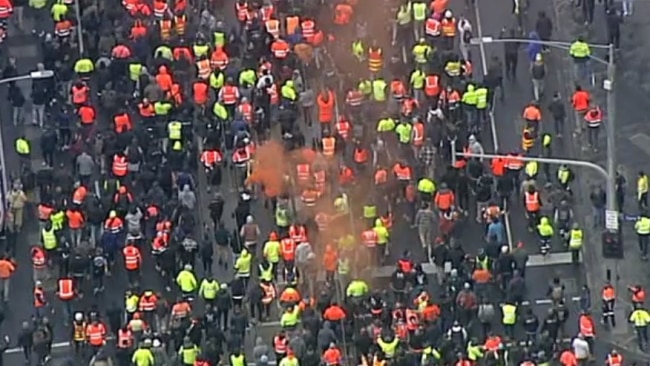 Protesters storming through the streets of locked down Melbourne have let off fireworks and flares. Picture: Sky News Australia