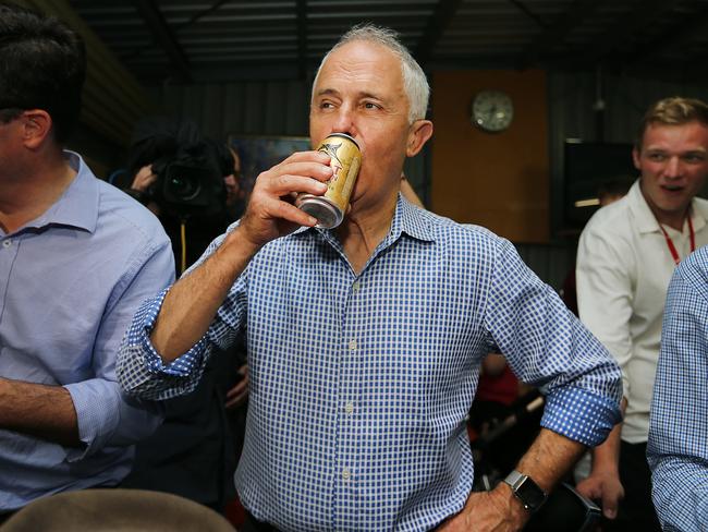 Prime Minister Malcolm Turnbull (pictured having a beer in Queensland in March) had a few quiet drinks with locals in Albury this week. Pictures: Jack Tran