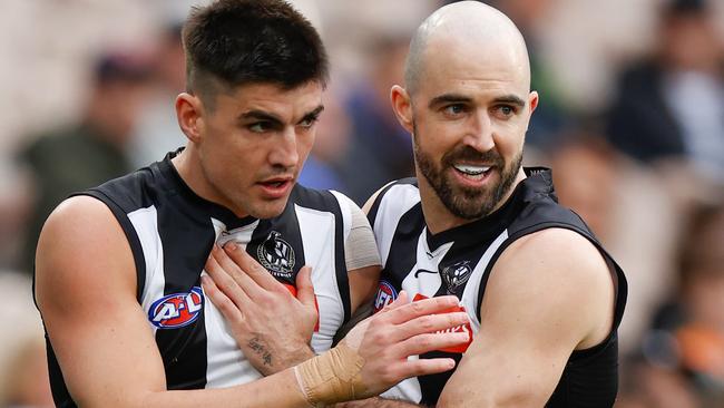 Brayden Maynard and Steele Sidebottom celebrate the Pies’ great escape. Picture: AFL Photos/Getty Images