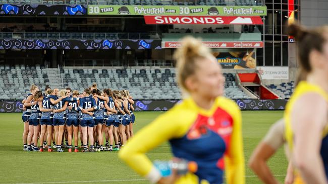 The Cats huddle after their loss to Adelaide on Friday night. Picture: Dylan Burns/AFL Photos via Getty Images