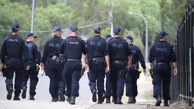 Police search the grounds of Prestons Public School.