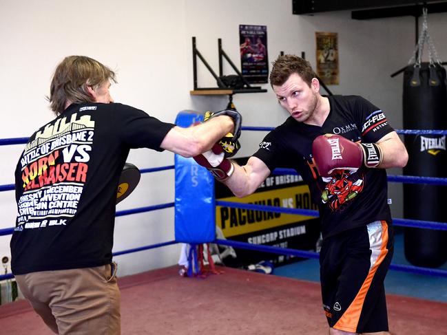 Jeff Horn hits the pads with trainer Glenn Rushton at the Stretton Boxing Club in Brisbane. Picture: Getty Images