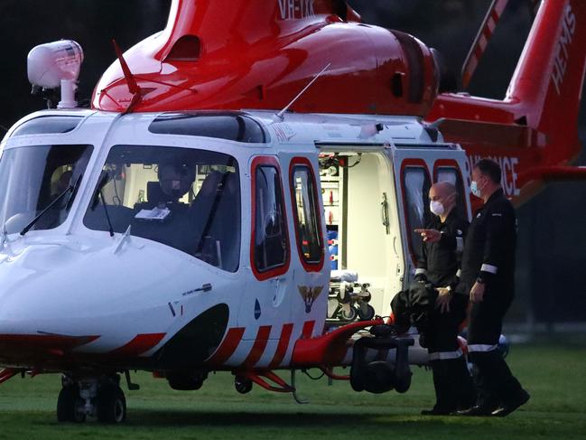 The Air Ambulance lands on the oval at Jan Juc to assist a boy injured in a bike accident. Picture: Alison Wynd