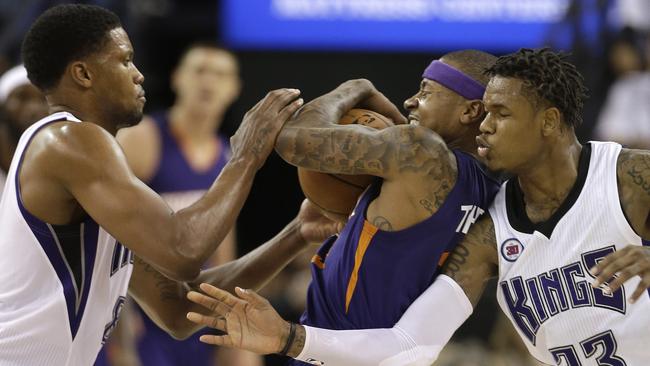 Phoenix Suns guard Isaiah Thomas is doubled-teamed by Sacramento Kings Rudy Gay and Ben McLemore.