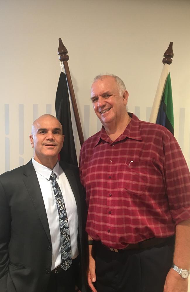 Indigenous education specialist Chris Sarra supports friend and colleague Ian Mackie as he accepts his PhD through Southern Cross University Gold Coast campus. Photo: Southern Cross University