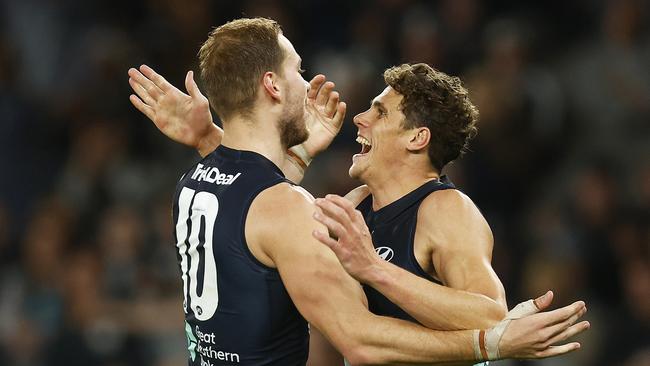 MELBOURNE, AUSTRALIA – MAY 08: Charlie Curnow of the Blues celebrates with Harry McKay of the Blues after kicking a goal during the round eight AFL match between the Carlton Blues and the Adelaide Crows at Marvel Stadium on May 08, 2022 in Melbourne, Australia. (Photo by Daniel Pockett/Getty Images)