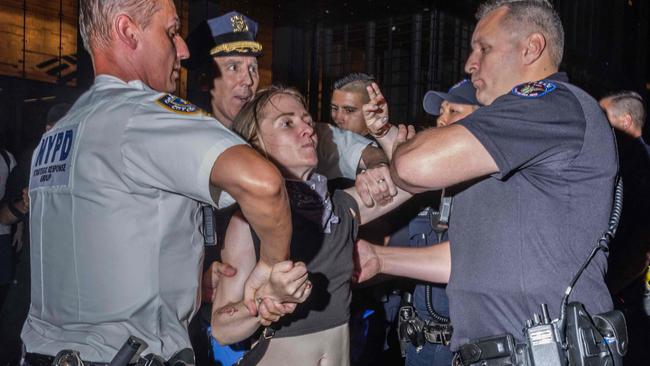 Police officers in New York arrest an abortion rights activist who blocked traffic. Picture: Alex Kent/AFP