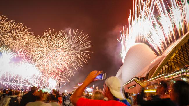 Fireworks explode over the Sydney Harbour Bridge and Sydney Opera House during the midnight display. Picture: Hanna Lassen/Getty Images