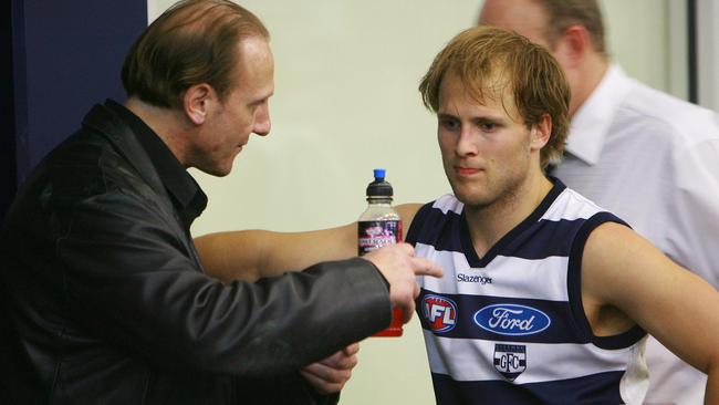 Gary Ablett talks to his dad after a game.