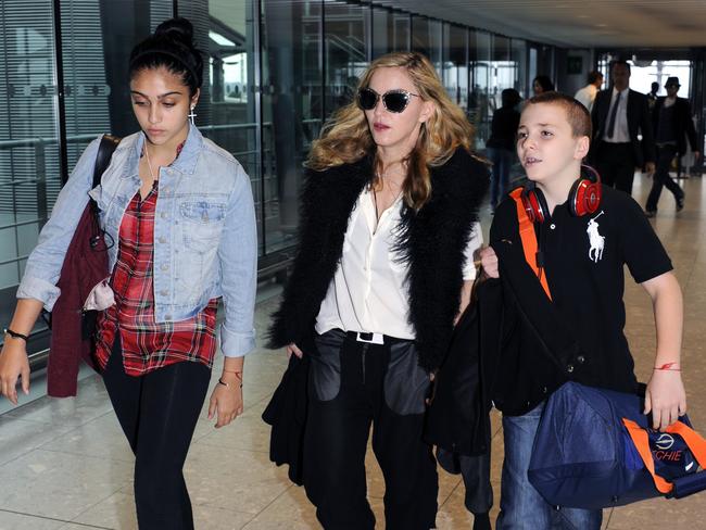 Jetsetters ... Madonna, Lourdes and Rocco leave London's Heathrow Airport for the US in 2011. Picture: AP Photo