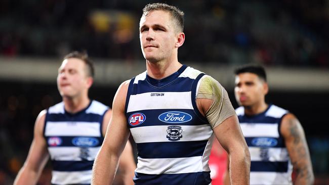 Joel Selwood leads Geelong off after losing to Adelaide.