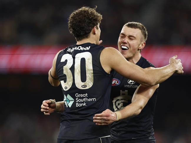 MELBOURNE, AUSTRALIA - AUGUST 12: Charlie Curnow of the Blues (L) celebrates with Patrick Cripps of the Blues after kicking a goal during the round 22 AFL match between Carlton Blues and Melbourne Demons at Melbourne Cricket Ground, on August 12, 2023, in Melbourne, Australia. (Photo by Daniel Pockett/Getty Images)