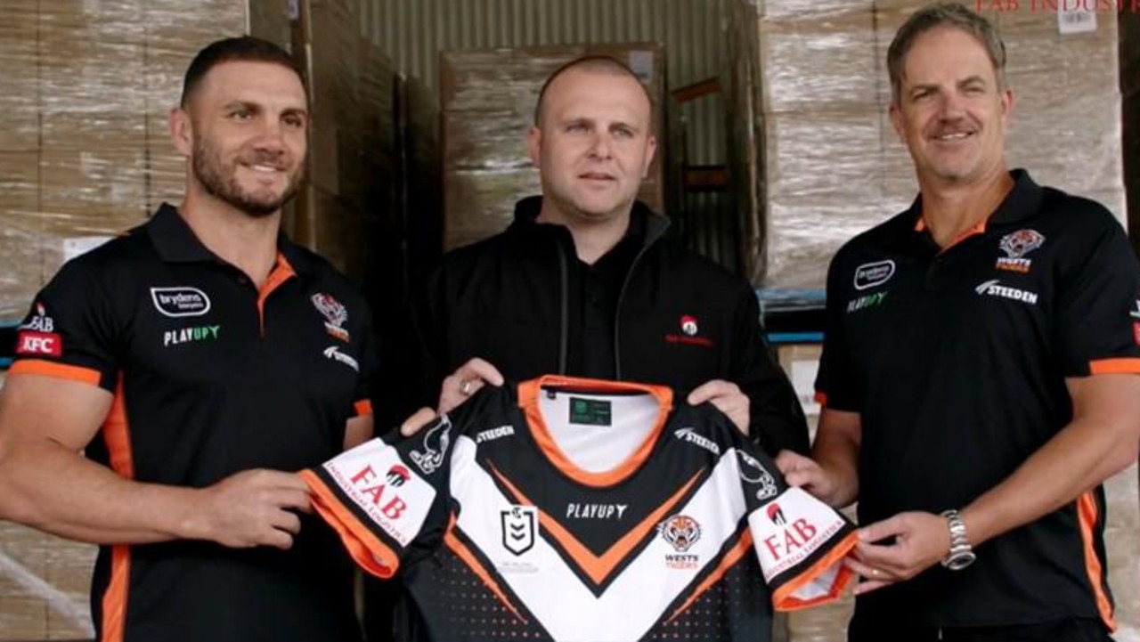 FAB Industrial Logistics managing director Neil Fabry (centre) with Wests player Robbie Farah and former CEO Justin Pascoe.