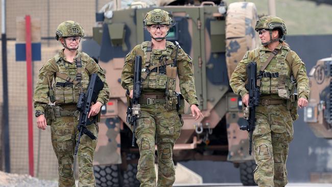 On patrol in standard kit at Camp Qargha north of Kabul in Afghanistan as part of ADF’s Force Protection Element are Lance Corporal Linda Keefe from Perth, Cpl Moira Walker from Melbourne and Private Chloe Hunt from Toowoomba. Picture: Gary Ramage