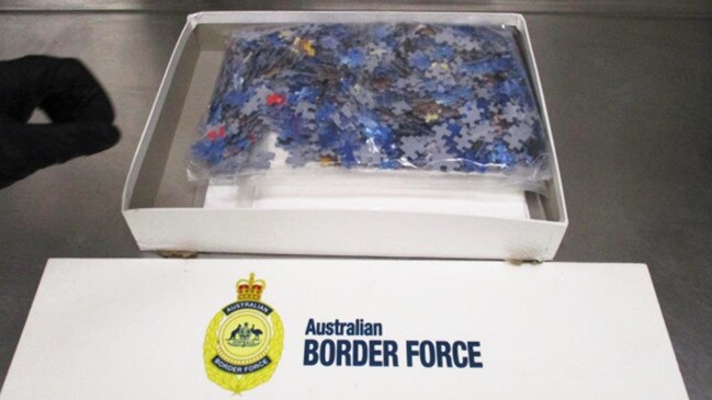 Australian Border Force officials intercepted a package from the United Kingdom containing 840g of cocaine that was marked as “comics” but instead contained a jigsaw puzzle. Picture: Australian Border Force