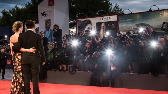 Johnny Depp and actress Amber Heard attend a movie premiere where they are photographed by awaiting media. Photo: Ian Gavan/Getty Images