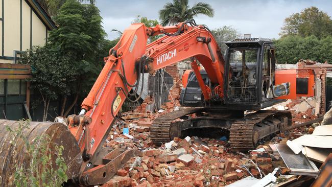 An excavator was destroyed by fire at a house demolition site in Lockleys Picture Dean Martin