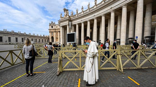 People line up to enter St Peter's Basilicain The Vatican on Monday. Picture: AFP