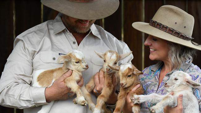 CAMP IN STYLE: Ashley and Carly Clark with baby goats at Splitters Farm.