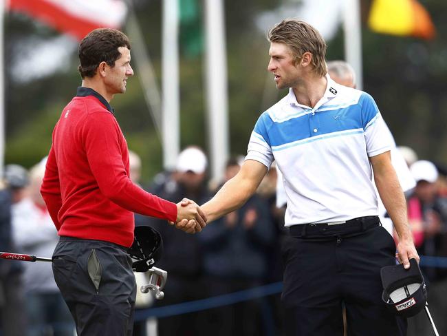 Australian Masters Round 1 at Royal Melbourne Golf Club. Adam Scott shakes hands with Jack Wilson after todays first round. Pic Michael Klein. Thursday November 14, 2011. MELBOURNE, AUSTRALIA.