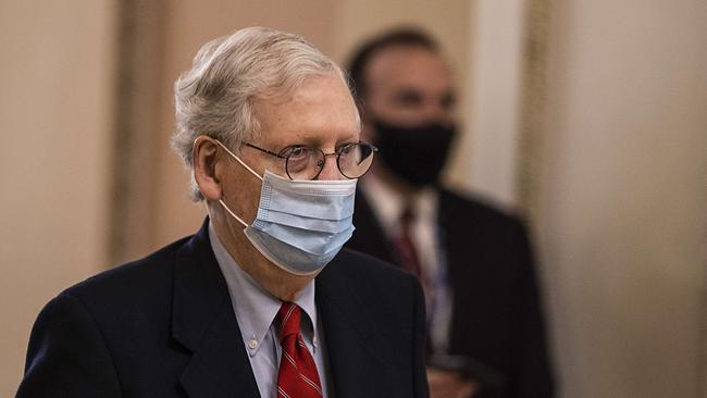 US Senate Majority Leader Mitch McConnell walks to open up the senate on Capitol Hill on December 20, 2020 in Washington, DC. Republicans and Democrats in the Senate finally came to an agreement on the coronavirus relief bill and a vote is expected later today.