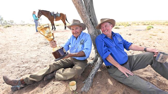 Former bush jockey Kevin ‘Spinny’ Monaghan and Birdsville Race Club president David Brook with the Birdsville Cup. Picture: Lyndon Mechielsen