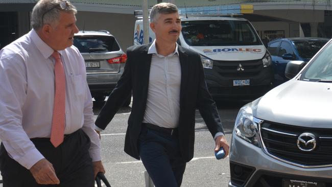 Alan Vico, right, arrives at Cairns District Court with solicitor Bebe Mellick. Mr Vico has pleaded not guilty to rape.