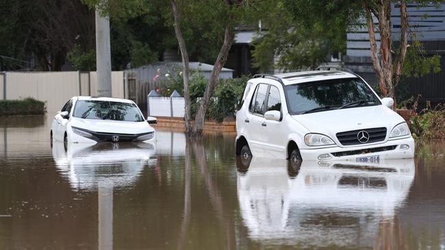 Cars partly submerged in Traralgon’s floods. Picture: David Caird