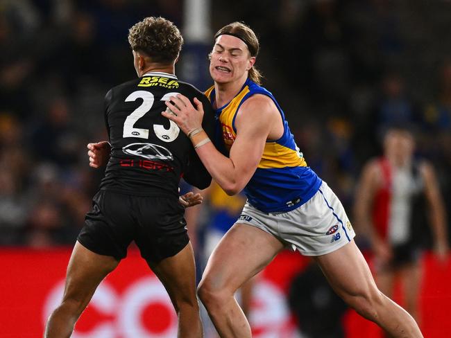 Harley Reid catches Liam Henry, who was injured. Picture: Morgan Hancock/Getty Images