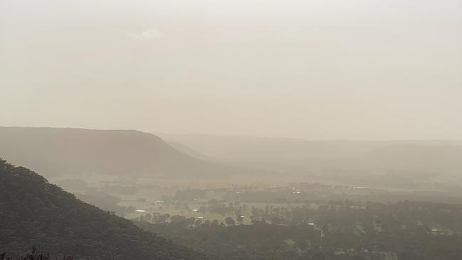 It’s expected the dust will keep sweeping east and may not clear the coast until Friday. Picture: John Grainger