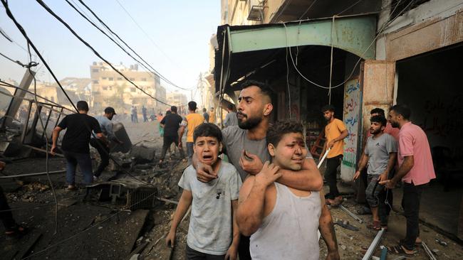 Palestinians search for casualties at the site of an Israeli strike in Gaza City. Picture: Reuters