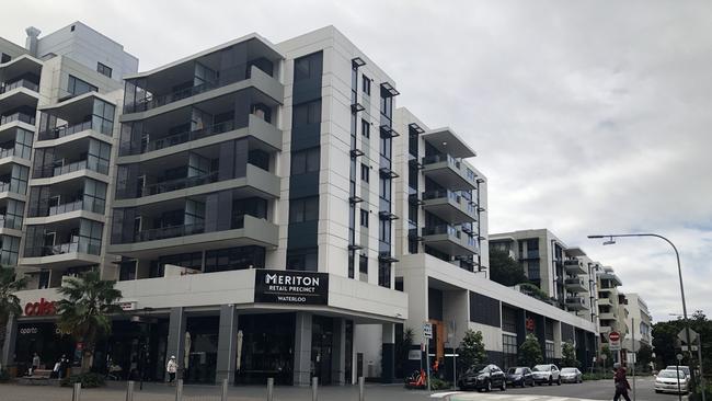 The Meriton Suites hotel building in Waterloo (far right) is part of a precinct which includes both residential units and retail.