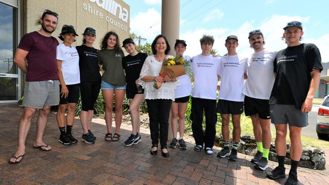 Members of Pace Shavers: Nathan Edwards, Kerry, Clay, Robin, Freya and Greer Schreiber, Lisa, Hamish and Ava Smith, and James Stimpson greet Ballina mayor Sharon Cadwallader with a bouquet of flowers and support for mental health in the region’s flood recovery. Picture: Cath Piltz